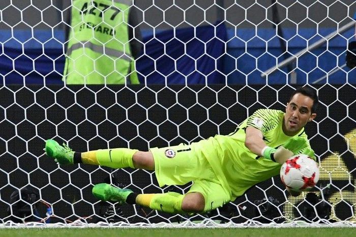 Chile's goalkeeper Claudio Bravo stops the ball by Portugal's forward Nani during the penalty shoot out during their 2017 Confederations Cup semi-final match in Kazan on June 28, 2017
