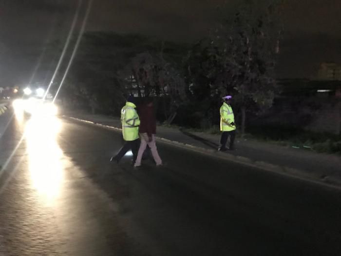 Police whisk away the drunk driver