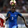 France's defender Benjamin Mendy (right) eyes the ball during a friendly match against Paraguay on June 2, 2017 at the Roazhon Park stadium in Rennes