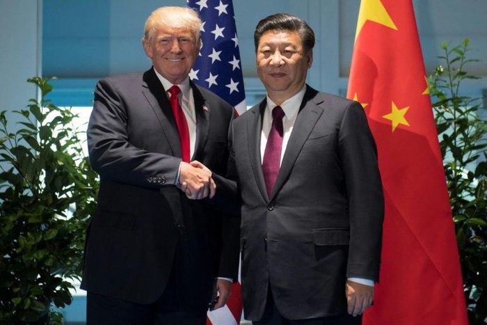 US President Donald Trump and Chinese President Xi Jinping (R) shake hands prior to a meeting on the sidelines of the G20 Summit in Hamburg, Germany on July 8, 2017