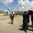 Relatives carry the coffin of a Afghan National Army soldier killed during a Taliban attack in Takhar Province. NATO will supply more troops following recent Taliban gains