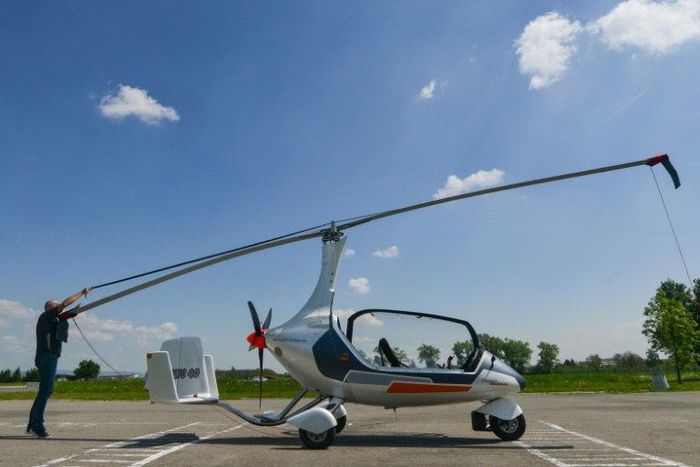 Czech pilot Pavel Brezina (L), owner of Nirvana Autogyro company, has made a "GyroDrive" -- a mini helicopter you can drive.