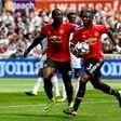 Manchester United's Eric Bailly (R) celebrates with teammate Romelu Lukaku after scoring a goal during their English Premier League match against Swansea City, at The Liberty Stadium in Swansea, south Wales, on August 19, 2017