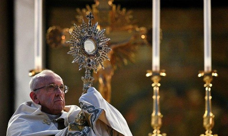 Pope Francis celebrates mass after a procession through Rome, on June 18, 2017
