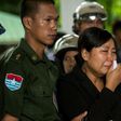 Khine Zin Win (C), who lost her youngest brother and his family, cries during the funeral in Dawei, Myanmar