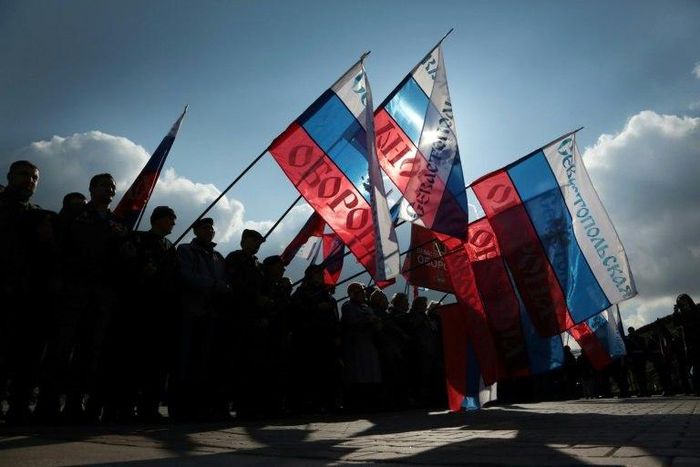 People wave Russian national flag as they celebrate the third anniversary of the annexation of the Crimea by the Russian Federation in Sevastopol in March 2017