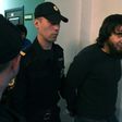 Zaur Dadayev, one of five defendants found guilty by a Moscow court over the 2015 murder of Russian opposition leader Boris Nemtsov, seen here being escorted by police officers on June 22.