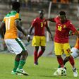Ivory Coast's Jean Michael Seri (R) and Franck Kessie (L) fight for the ball with Guinea's Seydouba Soumah (C) during the 2019 Africa Cup of Nations qualifying football match June 10, 2017