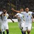 Malaysian players celebrate after scoring winning goal against Indonesia during their 29th Southeast Asian Games (SEA Games) football semi-final match, at Shah Alam Stadium outside Kuala Lumpur, on August 26, 2017