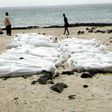 A photo taken in March 2006 and obtained from the United Nations High Commissioner for Refugees (UNHCR) shows the bodies of young men believed to be Somali refugees, found on Yemen's Red Sea coastline in Shabwa province