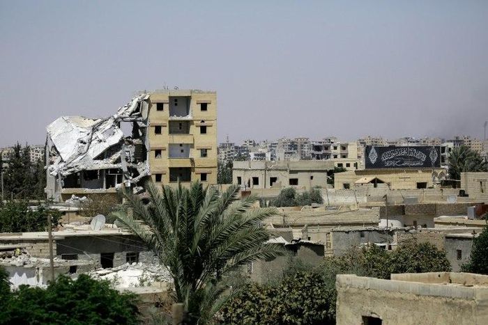 Damaged buildings in Raqa's western al-Darya neighbourhood, pictured on August 14, 2017 as Syrian Democratic Forces (SDF), a US backed Kurdish-Arab alliance, battle to retake the city from the Islamic State (IS) group