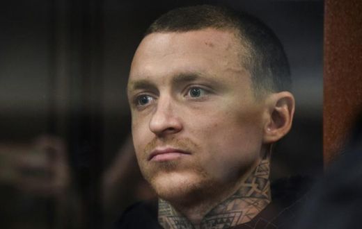 Russian footballer Pavel Mamaev, detained as a suspect in a criminal probe over hooliganism following an unprovoked attack on two government officials, attends a court hearing in Moscow on October 11, 2018