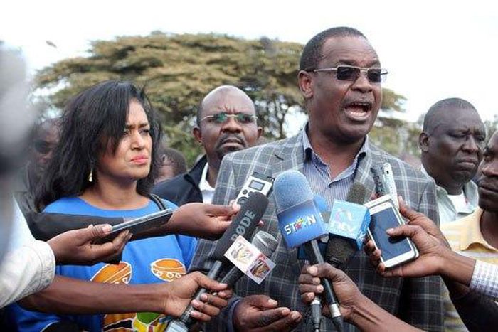 Nairobi Governor Dr Evans Kidero with Nairobi Weman Representative candidate Esther Passaris address the media after attending a church service at Regina Caeli Catholic Church in Karen.