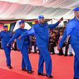 Police officers march in the new uniform unveiled by Uhuru