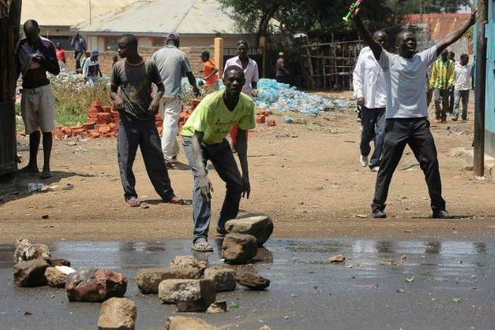 National Super Alliance (NASA) opposition coalition supporters demonstrate in the streets of the Kondele Estate in Kisumu, along Lake Victoria, demanding their candidate to be named the winner in the general elections on August 11, 2017