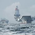 Beijing sent its only aircraft carrier, the Liaoning (r), through the Taiwan Strait in January during a drill and also in July when it was en route to Hong Kong