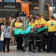 Emergency personnel help the injured after a commuter train hit the end of a platform at Barcelona's Francia station on July 28, 2017