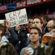 A fan holds up a CR7 sign ahead the Champions League quarter-final first-leg between Bayern Munich and Real Madrid in Munich, southen Germany on April 12, 2017