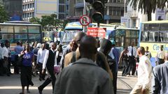 Kenyans on a busy Nairobi street. Mobile loan app services have come up with a new strategy to compel defaulters to pay up their loans