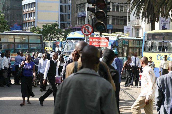 Kenyans on a busy Nairobi street. Mobile loan app services have come up with a new strategy to compel defaulters to pay up their loans
