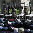 Palestinian Muslim worshippers refuse to enter the Al-Aqsa mosque compound after Israeli set up metal detectors and cameras as part of new security measures