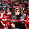 Arsenal supporters wear masks of French striker Alexandre Lacazette in the crowd ahead of the English FA Community Shield football match between Arsenal and Chelsea at Wembley Stadium in north London on August 6, 2017