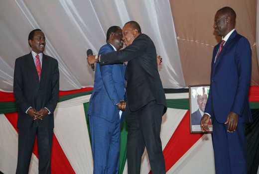___9158739___2018___12___2___13___Kalonzo+Musyoka+and+DP+William+Ruto+watch+as+President+Uhuru+Kenyatta+and+Raila+Odinga+hug+during+the+National+Prayer+Breakfast