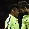 Barcelona's Neymar (L) celebrates after scoring a goal with teammate Gerard Pique