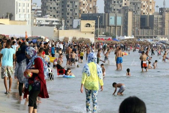 A rocket hit a beach in Tripoli killing five people, including at least one child, and wounding 25 others