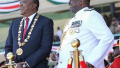 President Uhuru adorning his CGH medal with General Mwathethe during 2017 Jamhuri Day celebrations