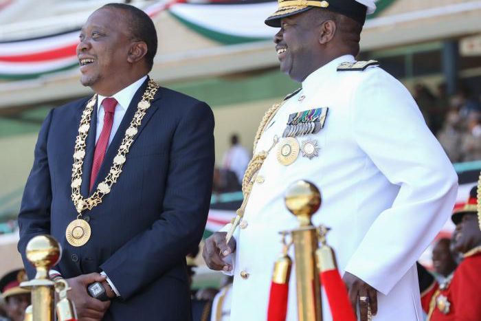 President Uhuru adorning his CGH medal with General Mwathethe during 2017 Jamhuri Day celebrations
