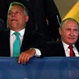 Russian President Vladimir Putin (R) sits next to Hungarian Prime Minister Viktor Orban during the World Judo Championships in Budapest on August 28, 2017