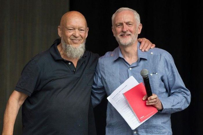Britain's opposition Labour party leader Jeremy Corbyn (R) pictured with festival founder Michael Eavis on the Pyramid Stage at the Glastonbury Festival near the village of Pilton in Somerset, south-west England on June 24, 2017
