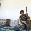 Yazidi fighter Heza prepares her rifle in an abandoned home used as a base on the eastern outskirts of Raqa on July 18, 2017
