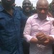 Evans flanked by security operatives