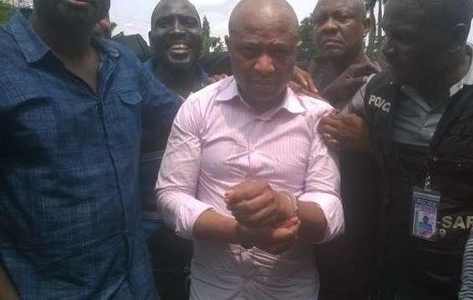 Evans flanked by security operatives