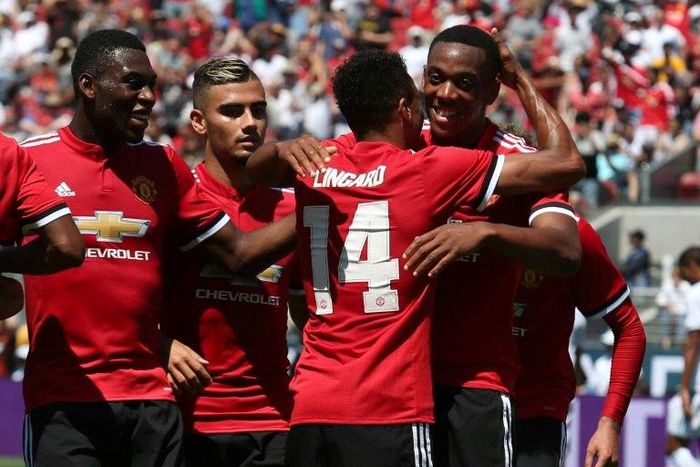 Manchester United forward Anthony Martial (R) celebrates with midfielder Jesse Lingard after Lingard scored a goal on July 23, 2017 in Santa Clara, California