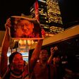 An activist holds a poster of terminally-ill Nobel laureate Liu Xiaobo on the sidelines of a vigil for him in Hong Kong on June 29, 2017.Liu wants Chinese authorities to let him get treatment abroad, friends say, as officials said his cancer has spread...