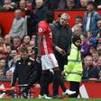 Manchester United's defender Eric Bailly (L) talks with manager Jose Mourinho during an April 2017 match