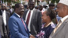 Raila shakes hands with Governor Waiguru during 2018 Devolution Conference