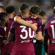 Manchester City's John Stones congratulates teammate Nicolas Otamendi after scoring a goal during their International Champions Cup match against Real Madrid, at Los Angeles Memorial Coliseum, on July 26, 2017