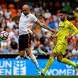 Valencia's Simone Zaza (L) fights for the ball with Villarreal's Alvaro Gonzalez during their Spanish La Liga match, at the Mestalla stadium in Valencia, in May 2017