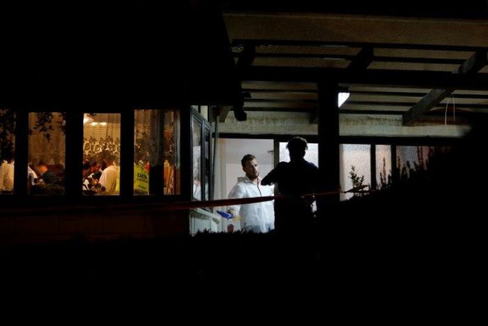 Israeli forensic police on July 22, 2017 inspect a home where a Palestinian broke in the day before and stabbed four Israelis, killing three of them, in the Jewish settlement Neve Tsuf in the occupied West Bank