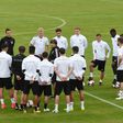 Germany's national football coach Joachim Loew (C) talks to his players prior a training session in Herzogenaurach, southern Germany, on June 9, 2017