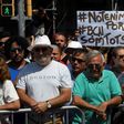 Somebody holds up a sign reading "We are not afraid. Barcelona, we are all" before a crowd observes a minute of silence for the victims of the Barcelona attack at Plaza de Catalunya on August 18, 2017