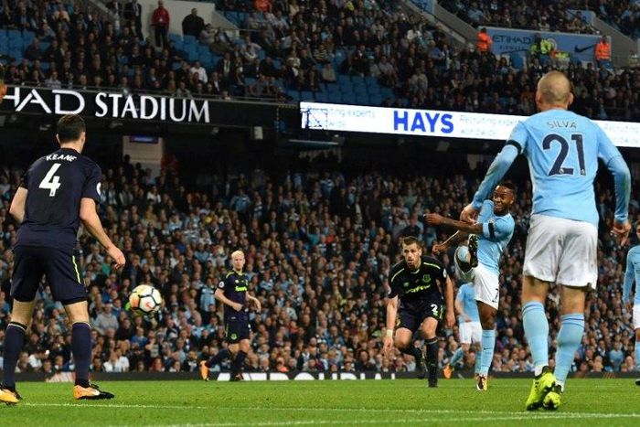 Manchester City's midfielder Raheem Sterling (2ndR) scores against Everton at the Etihad Stadium in Manchester, north west England, on August 21, 2017