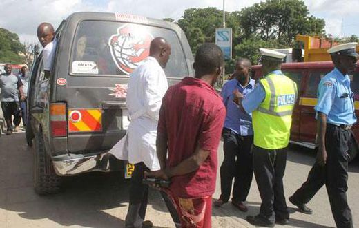 File image of police officers on duty. A matatu in Embu sped off with two police officers who were later dumped in a forest in Kirinyaga