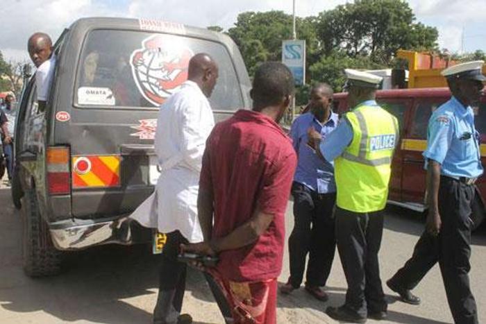 File image of police officers on duty. A matatu in Embu sped off with two police officers who were later dumped in a forest in Kirinyaga