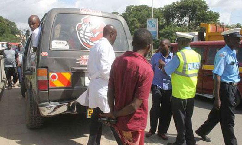File image of police officers on duty. A matatu in Embu sped off with two police officers who were later dumped in a forest in Kirinyaga