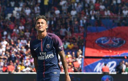 Paris Saint-Germain's Brazilian forward Neymar looks on during his presentation to the fans at the Parc des Princes stadium in Paris on August 5, 2017